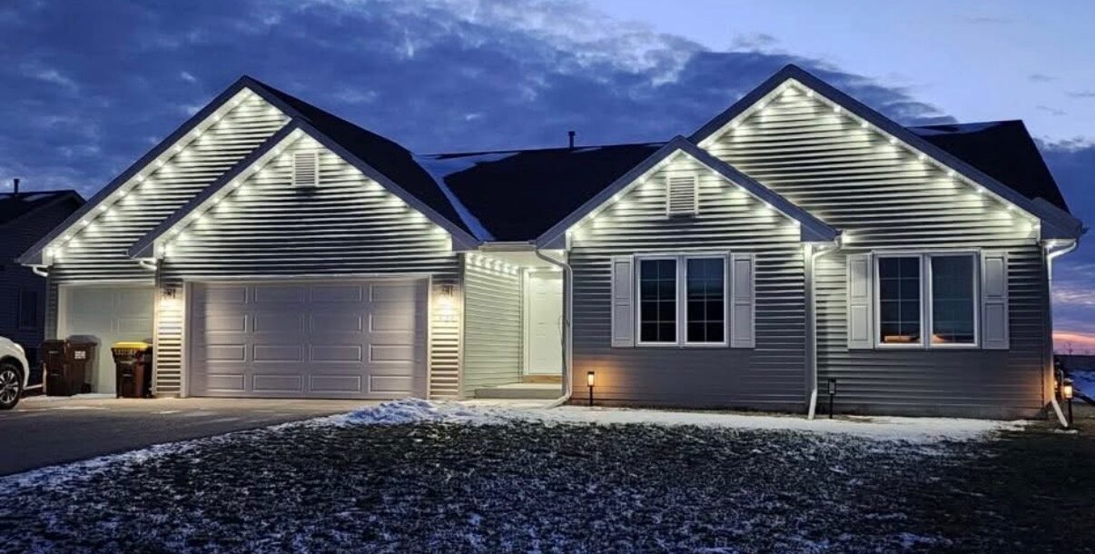 Screenshot Home with white roofline Christmas lights at dusk